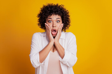 Speechless crazy young woman face in excitement hands cheeks open mouth unexpected reaction