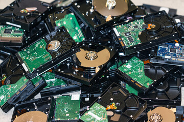 many computer hard drives are in a heap for disposal