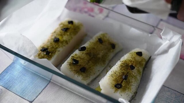 Preparacion of a seafood (codfish with black garlic)