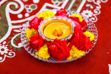 Traditional wedding ceremony in Hinduism: Turmeric in plate for haldi ceremony