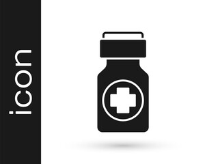 Black Medicine bottle and pills icon isolated on white background. Bottle pill sign. Pharmacy design. Vector