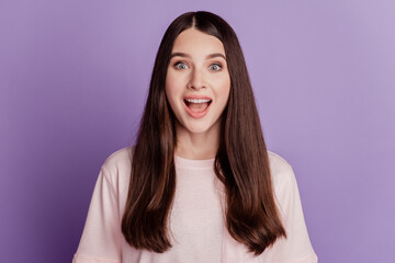 Fototapeta premium Portrait of amazed happy beautiful woman surprised reaction open mouth