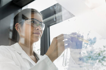 Germany, Bavaria, Munich, Female scientist working in laboratory