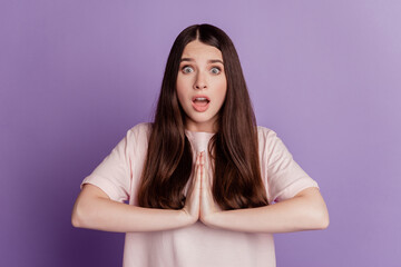 Surprised happy beautiful woman make pleading gesture excited face open mouth