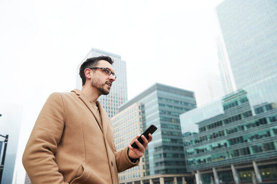 UK, London, Man using phone in downtown