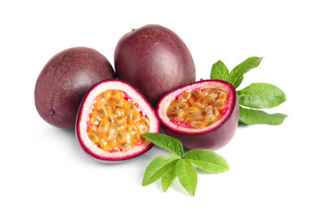 Cut and whole passion fruits with leaves on white background