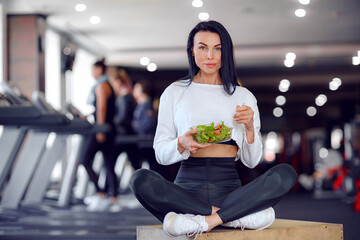 sport woman eating salad