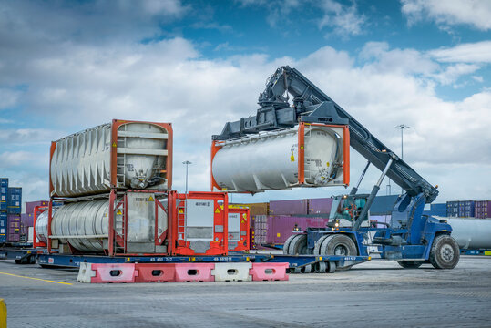 UK, Kingston upon Hull, Forklift truck handling fuel tank at terminal