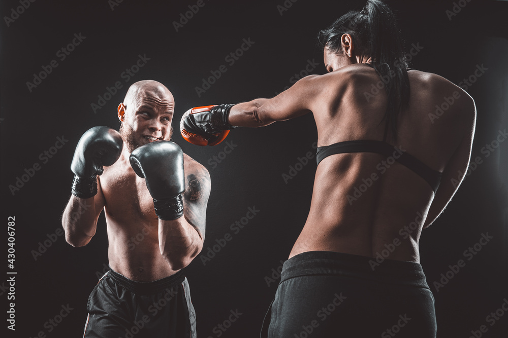 Canvas Prints Shirtless Woman exercising with trainer at boxing and self defen