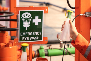 Clean water bottle at emergency eye wash station, using in case of accident to washing personal's...
