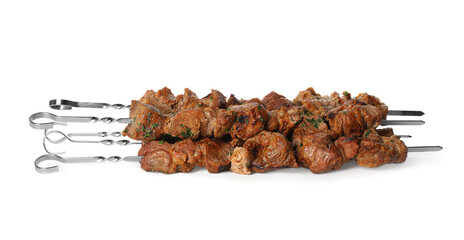 Metal skewers with delicious meat on white background