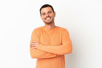 Fototapeta premium Brazilian man over isolated white background keeping the arms crossed in frontal position