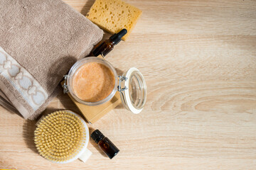 Ecologic concept. Spa still life with essential oil, hand made soap and dry massage brush. Zero waste products for personal care