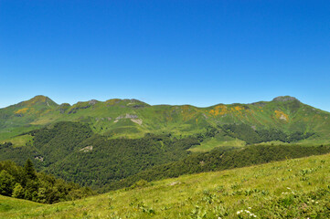 Magnificent view of a panorama of volcanic mountains in a national park in a wild region, in Auvergne