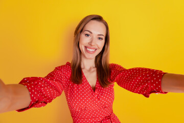 Young woman take selfie toothy smile on yellow wall