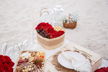 heart shaped flower arrangement on the sand