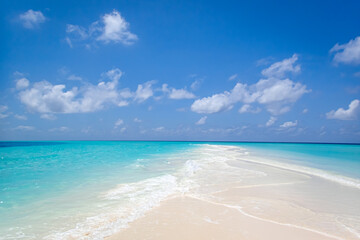 Beautiful sandbank under blue sky and white clouds