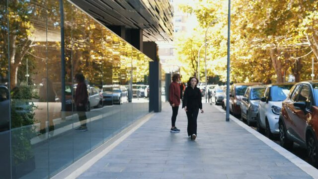 quarrel between friends - young woman chases her warlike friend who rejects her
