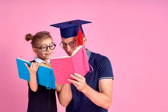 Man in academic hat holding book, study together with cute prete