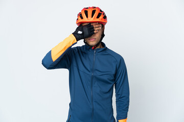 Young cyclist Brazilian man isolated on white background covering eyes by hands. Do not want to see something
