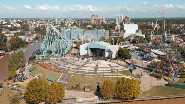 El Octogono Stage Of Amphitheatre With Amusement Rides At Costa Park In Tigre, Buenos Aires, Argentina. - aerial
