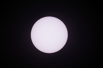 Detailed Close up telephoto of the sun in the sky taken using a super telephoto lens. Shoot from East Java Indonesia 3 April 2021 1.44 pm.
