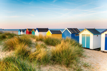Pretty beach huts in the sand dunes