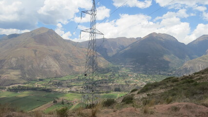 view of the mountains from the mountain with blue sky and white clouds