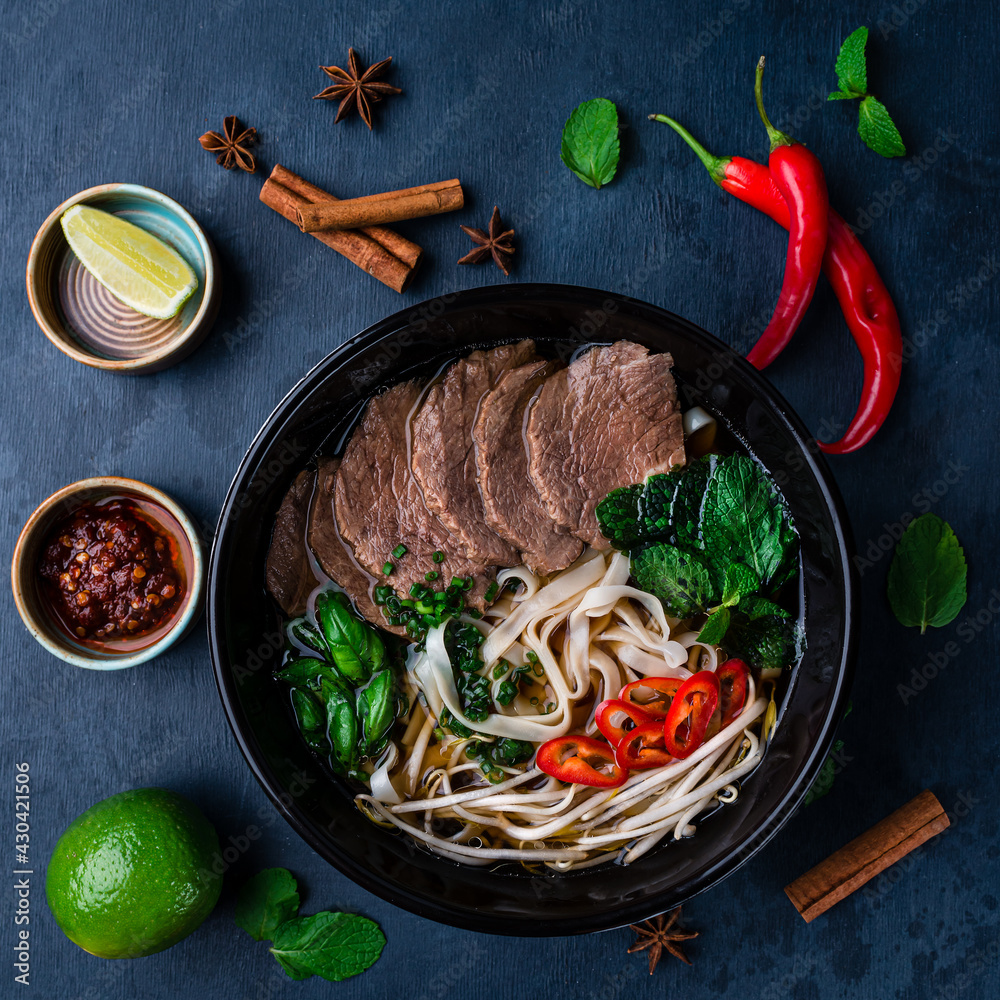 Wall mural pho bo, vietnamese food, rice noodle soup with sliced beef