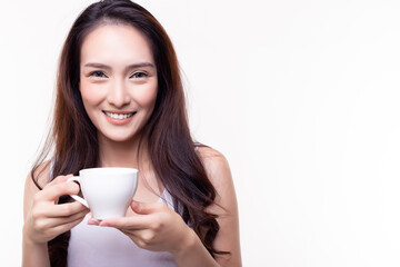 Woman drink hot coffee and hold coffee cup with smile face and happy in morning Beautiful girl drinking hot herbal tea and enjoy drinking it She stand over isolated on white background copy space