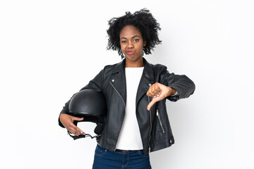 Young African American woman with a motorcycle helmet isolated on white background showing thumb down sign