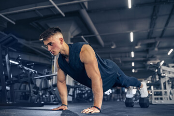 Young Adult Athlete Doing Push Ups As Part Of Bodybuilding Train