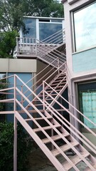 steel stairs inbetween outside and building surface