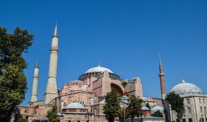 Fototapeta na wymiar Byzantine cathedral of Hagia Sophia in Sultanahmet Square in Fatih District on a sunny day. Istanbul, Turkey