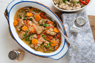 Beef stew in gravy with vegetables. Meat goulash