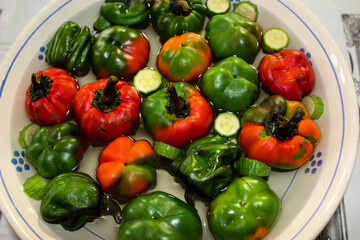Lots of colorful peppers immersed in water