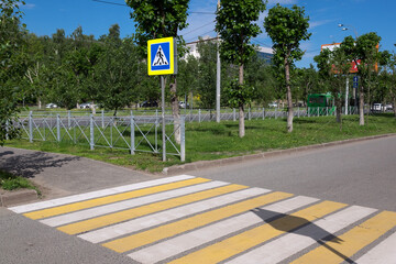 A man at a crosswalk. Traffic safety in the city.