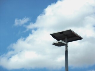 Solar cell lamp post on cloud background