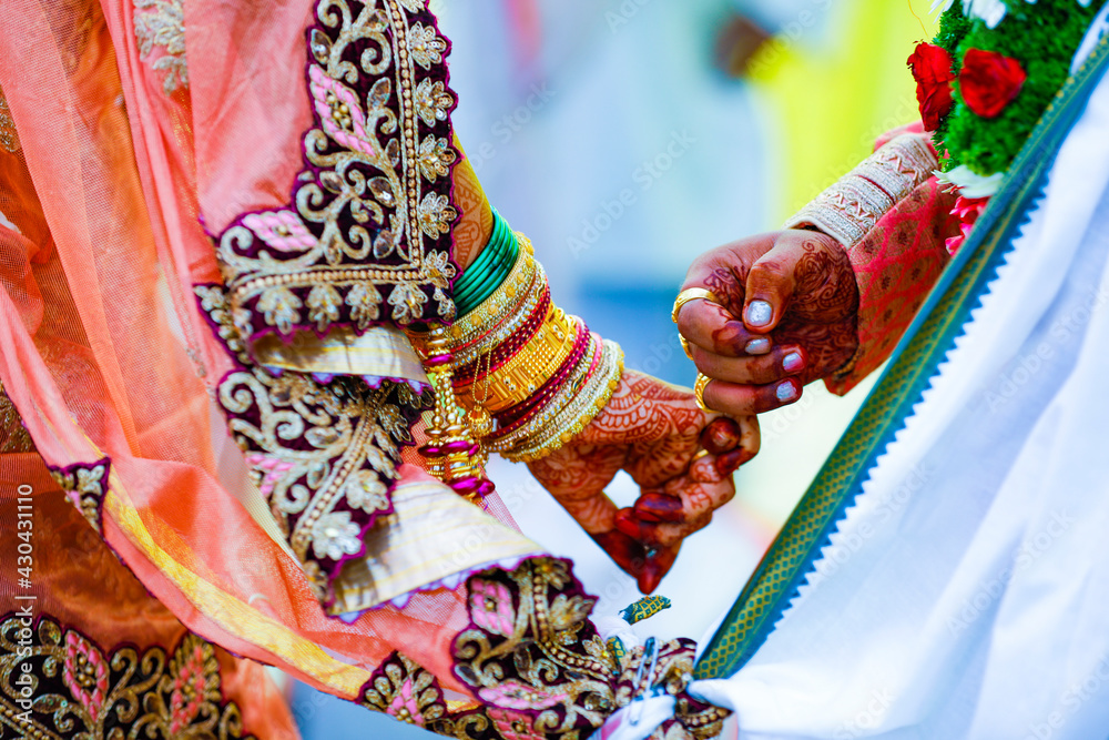 Wall mural indian couple hand in wedding satphera ceremony in hinduism