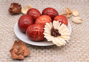 Red striped Easter eggs on a platter