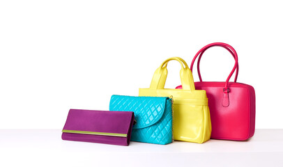 Colourful fashion purses. Many handbags on isolated on white. Shopping image