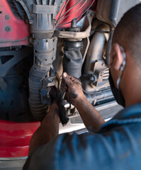 mechanic working on truck maintenance in brazil