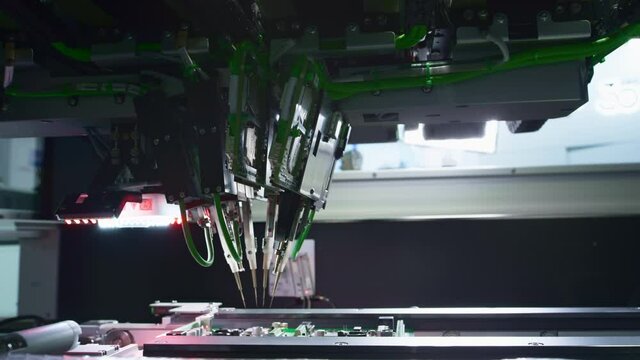 The fourth industrial revolution. Electronic circuit board production. Automated Circut Board machine Produces Printed digital electronic board. Electronics contract manufacturing. High-tech