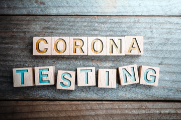 Corona Testing Written On Wooden Blocks On A Board