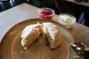 scone , scone with strawberry sauce and whipping cream