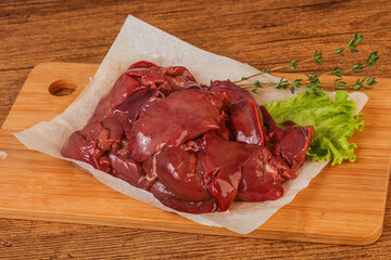 Raw chicken liver over board