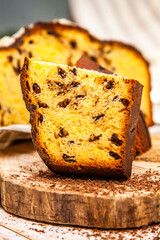 Panettone is the traditional Italian dessert for easter in 2021. Homemade panettone covered in chocolate and sprinkles. Bread served as dessert.