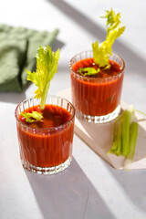 tomato juice with celery in the sunlight