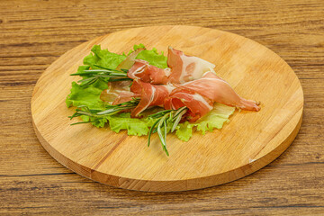 Sliced pork Jamon with rosemary