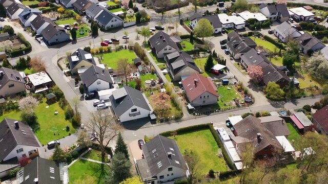 Aerial view of a new housing estate in Germany with single family houses and gardens in residential streets